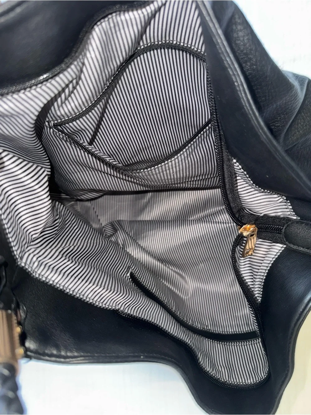 Black Leather Hobo Bag with Braided Handle and Tassel